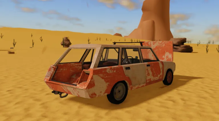 Rusted orange station wagon parked on a sand dune in A desrt